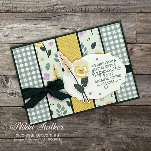 Card using strips of Pansy Petals DSP with sentiment and pansy in shades greens & yellow