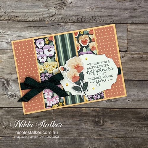 Card using strips of Pansy Petals dsp with sentiment and image in shades of coral & green